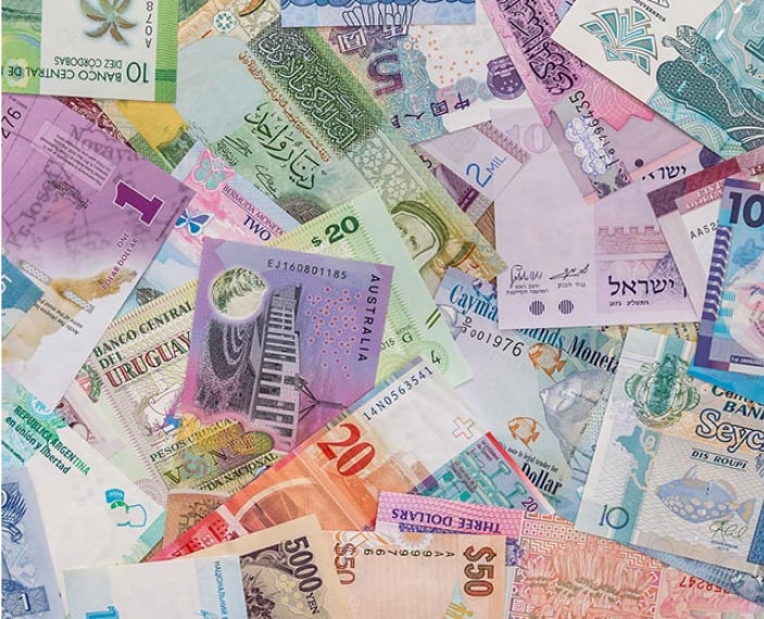 Photo showing a collage of currencies from multiple countries.